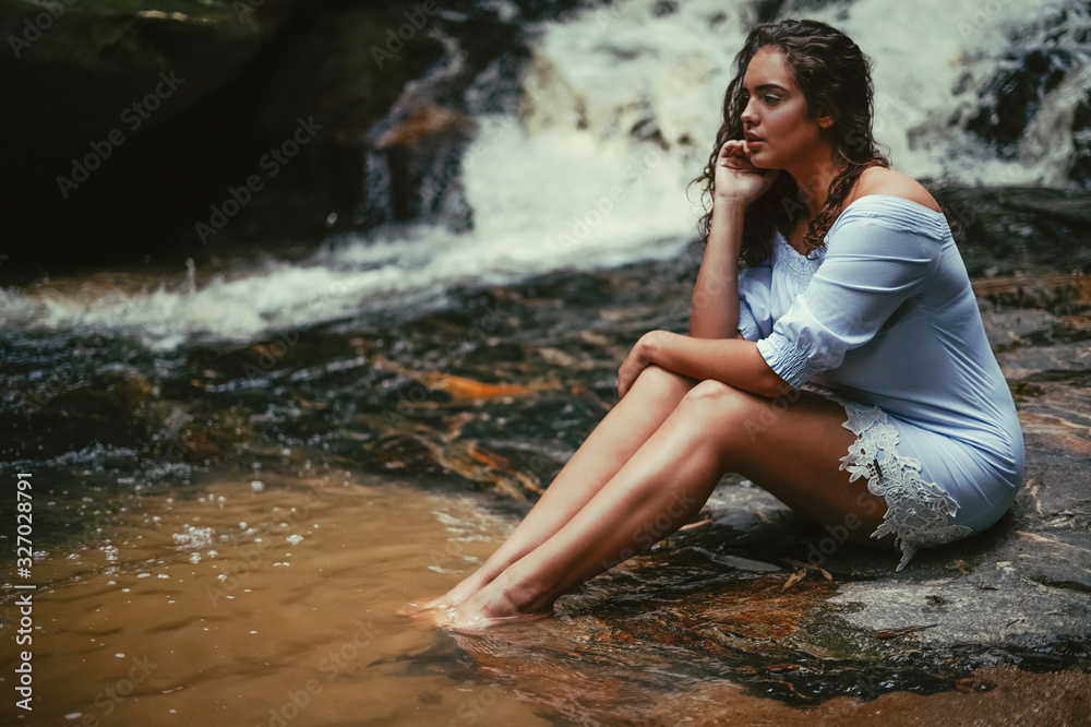 Portrait of a young woman in the waterfall Portrait of a young woman in the waterfall