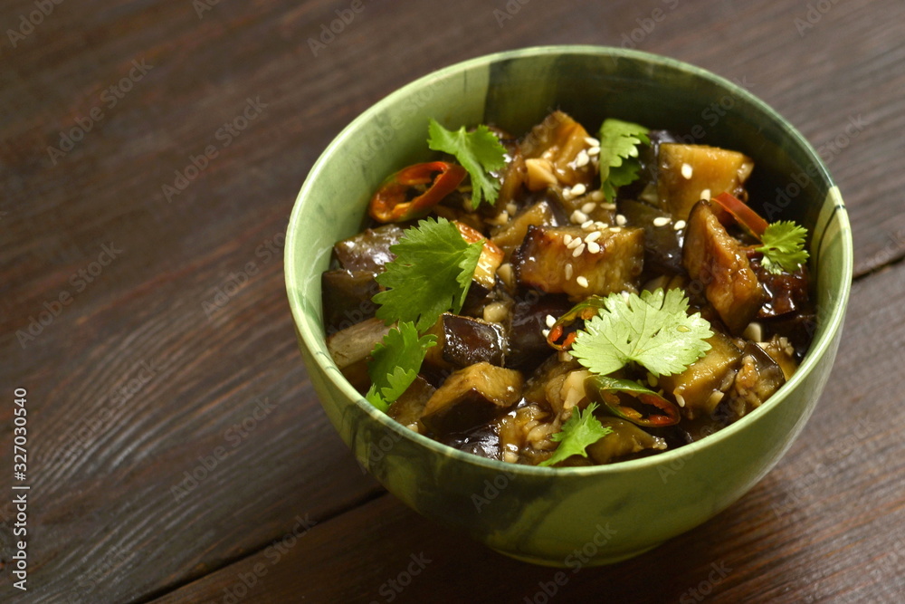Fried eggplant with garlic, cilantro in ginger and soy sauce, copy space Fried eggplant with garlic, cilantro in ginger and soy sauce, copy space