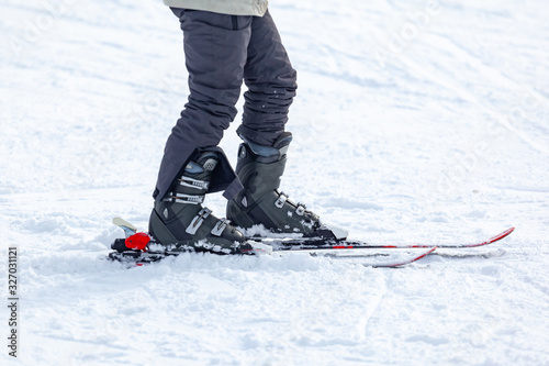 Young man on skis out of slopes, Equipment and extreme winter sports