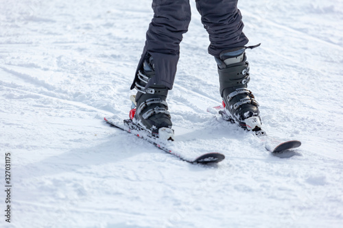 Young man on skis out of slopes, Equipment and extreme winter sports