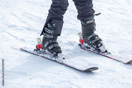 Young man on skis out of slopes, Equipment and extreme winter sports