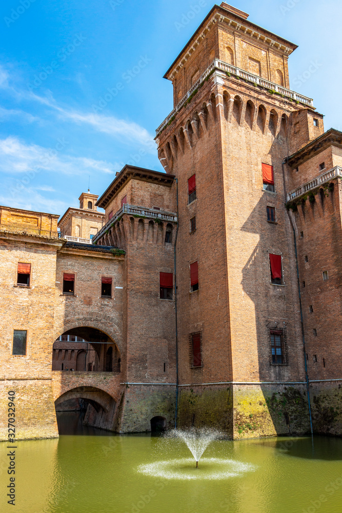 Castello Estense or Este castle exterior partial view with moat in Ferrara, Emilia-Romagna, Italy