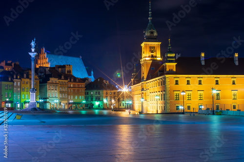 Streets of Warsaw Old Town by the night.  Zygmunt Column and Royal Castle. photo