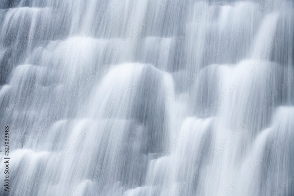 Close up of water flowing down a dam wall after heavy rain fall Close up of water flowing down a dam wall after heavy rain fall