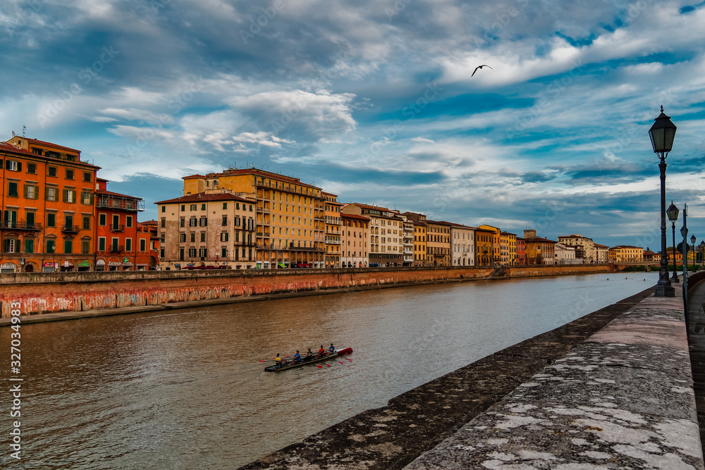 Obraz premium Pisa Italy 11/03/2018: Pisan lungarnos, adorned with wonderful buildings and bridges are the most picturesque and famous places in Pisa, and among the most romantic for sure.Pisa Tuscany Italy