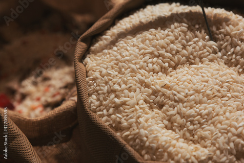 Wallpaper Mural Stock photo of a close-up of a sack full of rice at a market stall