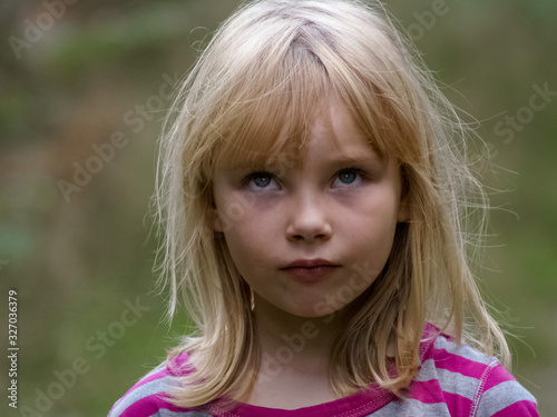 portrait of a little girl with a funny face