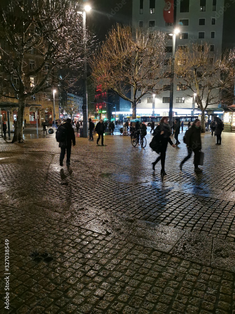 Obraz premium people walking on the street at night