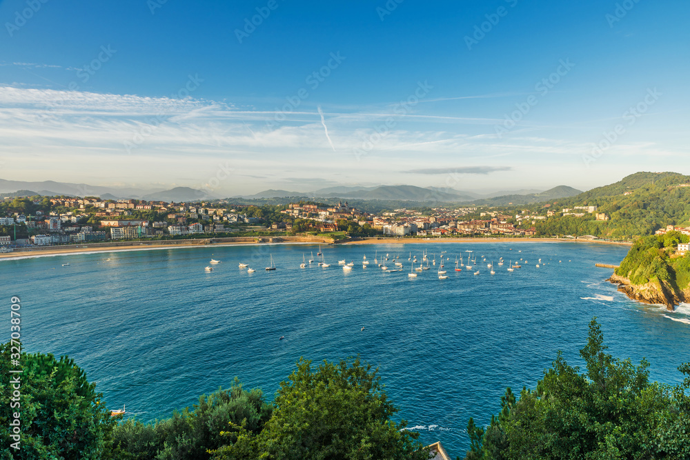 Aerial view of turquoise bay of San Sebastian or Donostia with beach La Concha at sunrise, Spain
