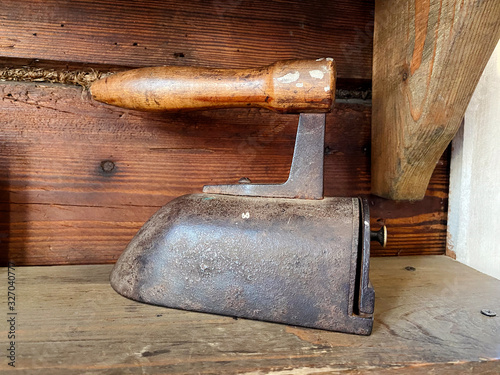 Antique cast iron with replaceable metal plates. photo