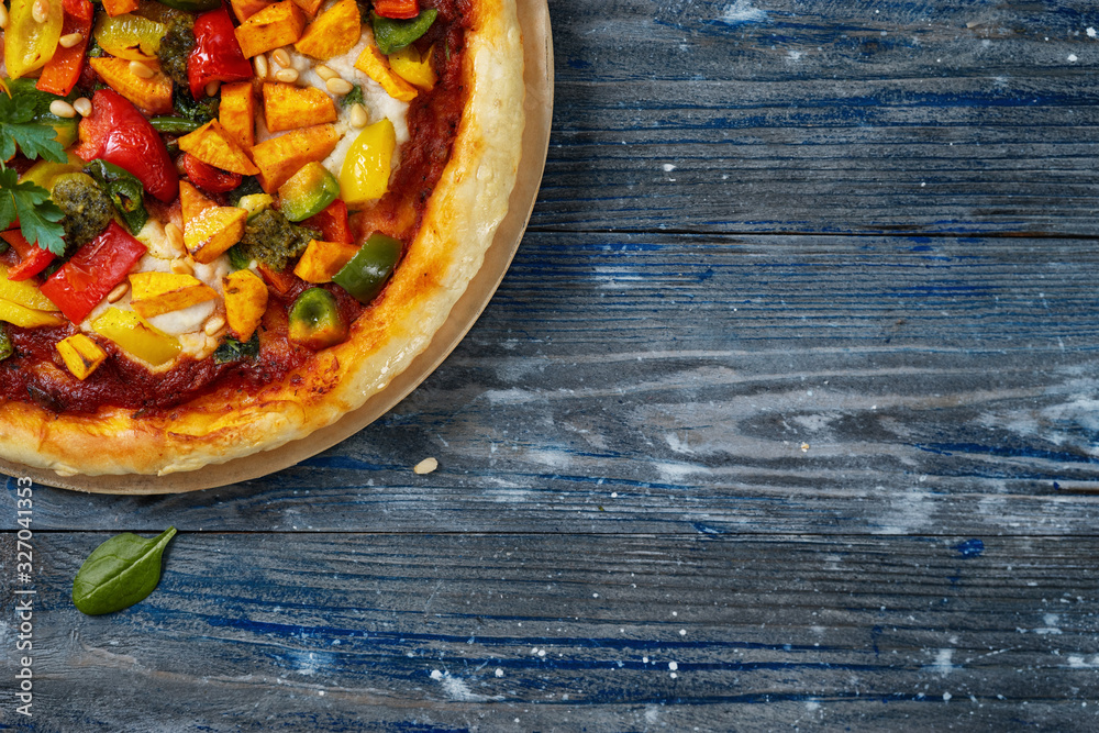 Vegan colorful pizza on blue background