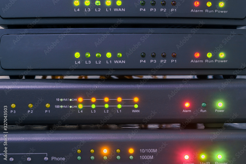 Devices for voice ip Internet connection are in racks. Technology concept. Network telephone routers are close-ups. Telecommunication equipment works in the server room of the data center. Devices for voice ip Internet connection are in racks. Technology concept. Network telephone routers are close-ups. Telecommunication equipment works in the server room of the data center.