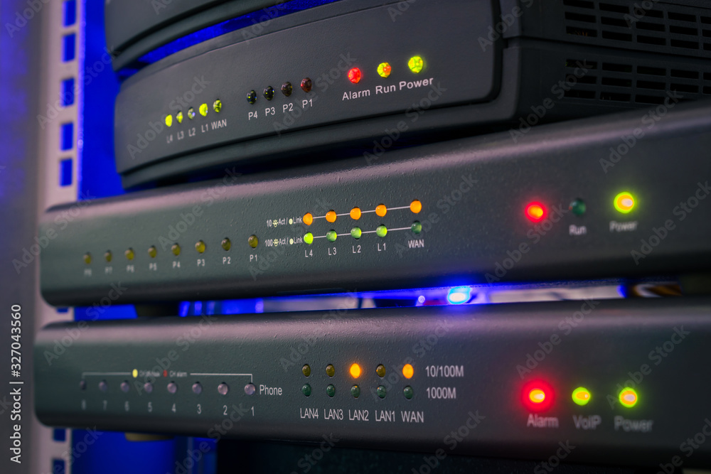 Communication equipment for voice Internet connection. Network gateways for ip telephony work in the server room. Color indication on the interfaces of office telephone routers. Technology concept