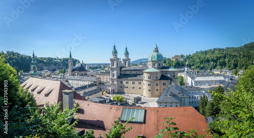 Panoramic view of The Franciscan Church, Salzburg Cathedral and Stift St. Peter Salzburg in Salzburg over the banks of Salzach river as seen from Fortress Hohensalzburg