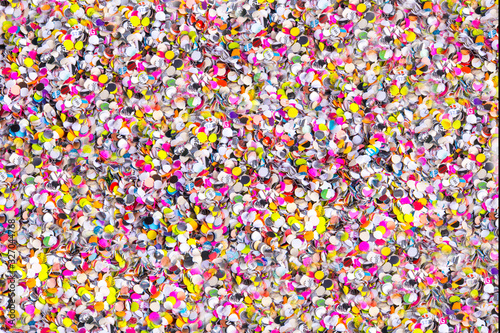 Confetti close up, various colors of round cut paper party confetti, horizontal background