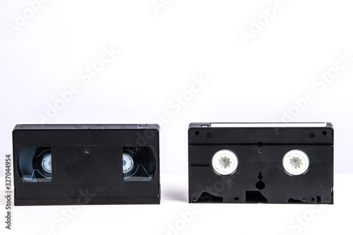 VHS video cassette isolated on white, retro video technology , analog magnetic tape 