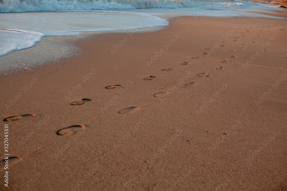 footprint of a couple in sandy beach footprint of a couple in sandy beach