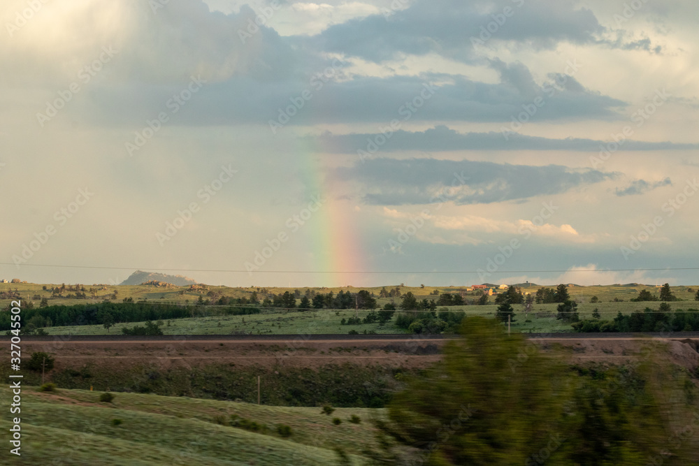A rainbow over a field. High quality photo
