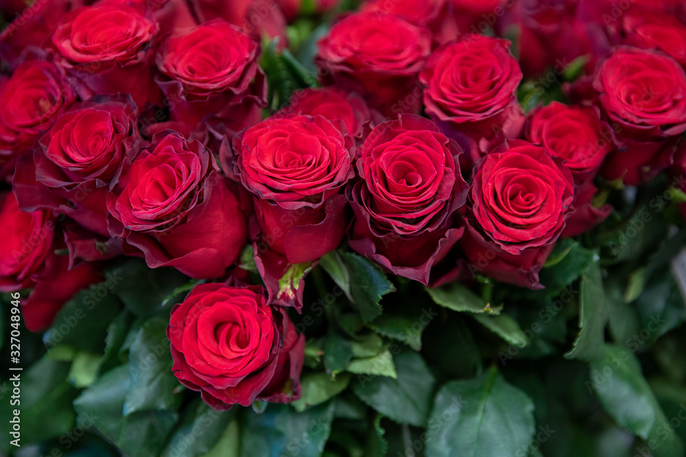 Beautiful bouquet of red roses made with love in the greek flowers boutique - preparation for Valentine's Day. Beautiful bouquet of red roses made with love in the greek flowers boutique - preparation for Valentine's Day.