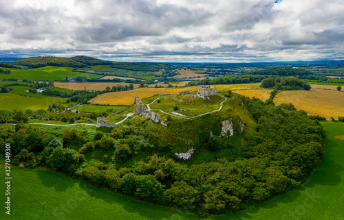 The Rock of Dunamase is a rocky outcrop in County Laois the ruins of Dunamase Castle, a defensive stronghold dating from the early Hiberno-Norman period.