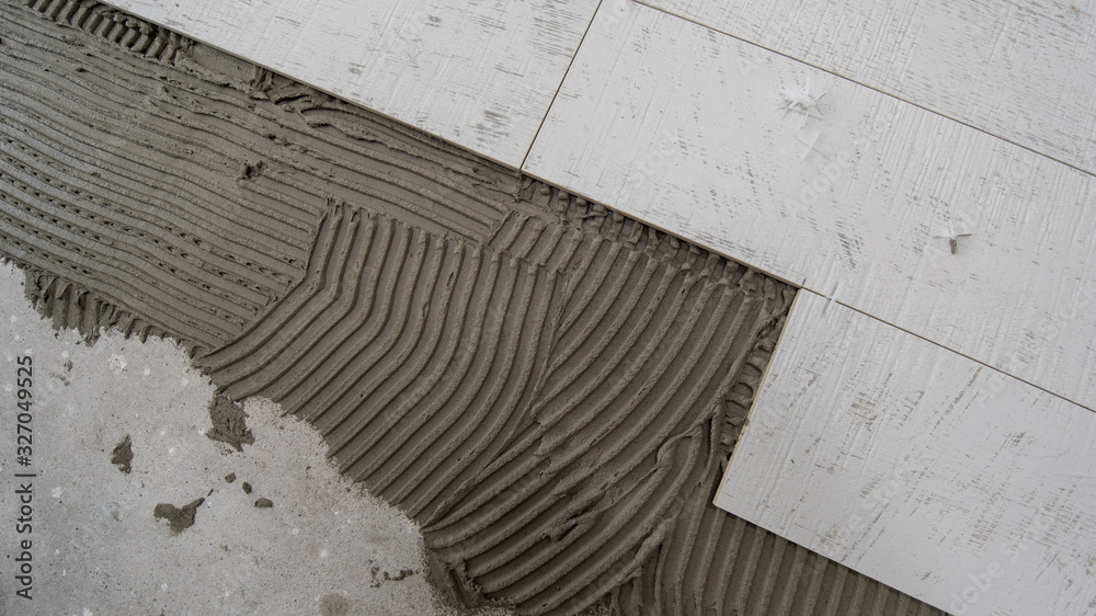 Ceramic wood effect tiles and tools for tiler on the floor Ceramic wood effect tiles and tools for tiler on the floor