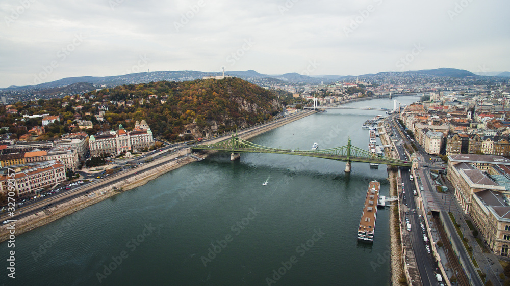 Obraz premium Budapest,Hungary - Aerial skyline view of Petofi Bridge .Boat Ride on the River Danube. Cloudy day