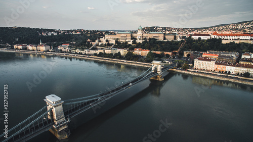 Aerial view of Buda Castle with Szechenyi Chain Bridge, Clark Adam Square. Buda Castle Royal Palace and Buda Tunnel at sunrise on a summer morning