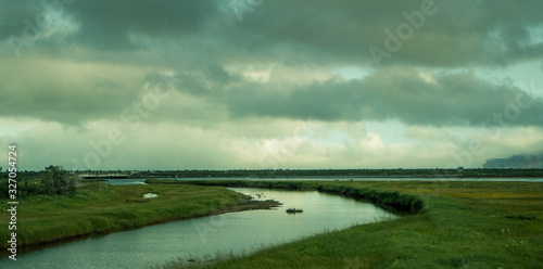Fototapeta Naklejka Na Ścianę i Meble -  landscape with a stream. landscape of the gaspésie. Landscape with water and grass