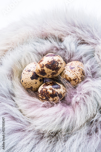 quail eggs in a wicker basket. Easter and easter decoration