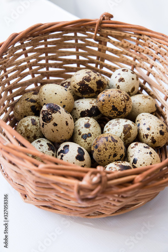 quail eggs in a wicker basket. Easter and easter decoration