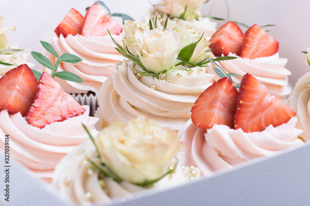 wedding cupcakes in a white box on a light background wedding cupcakes in a white box on a light background
