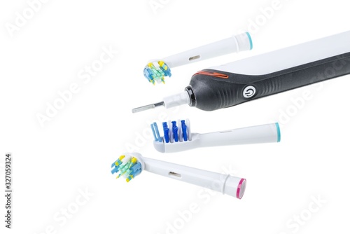 Three kinds of head and toothbrush close up view isolated. Health care concept.