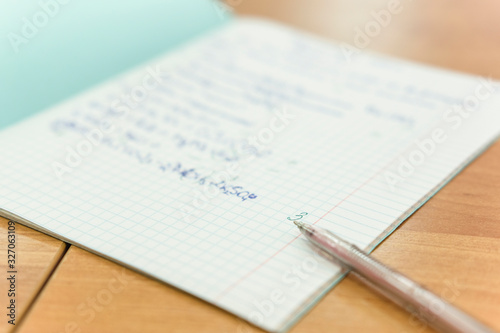image of a pen on a school notebook