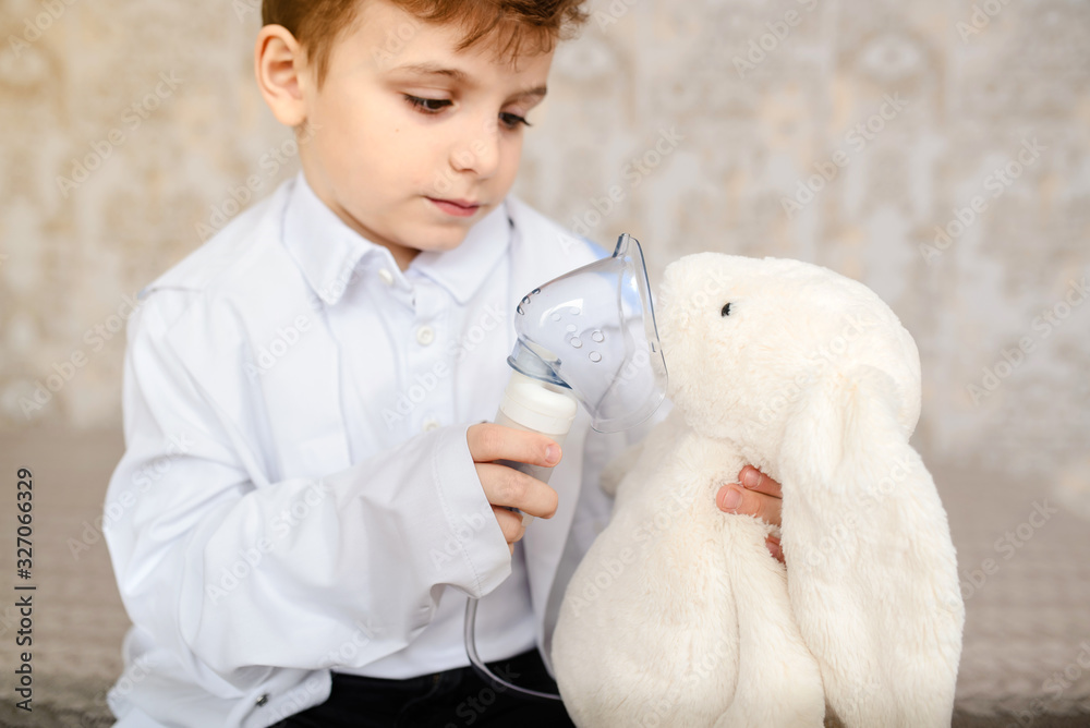 Little boy in white medical robe having fun, Little boy in white medical robe having fun,