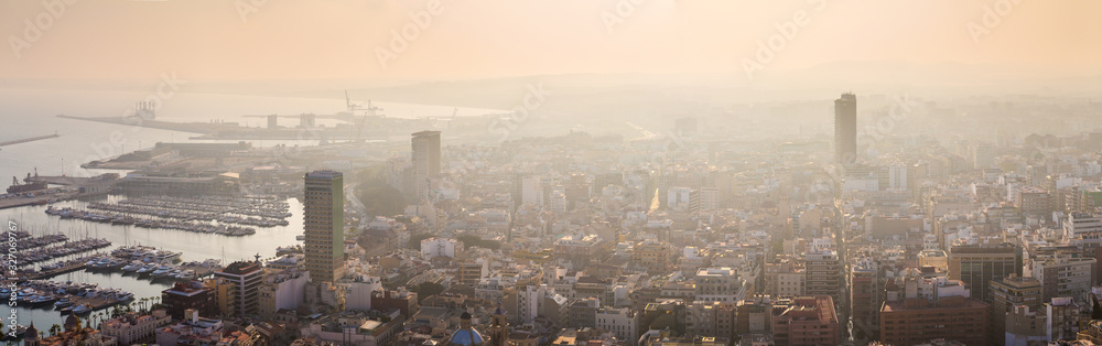 Breathtaking aerial panoramic view from Mount Benacantil of beautiful sunset over old part city of Alicante. Costa Blanca. Alicante, province of Valencia, Spain.