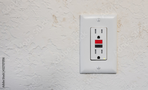 Ground fault interrupter electricity receptacle and wall plate. Residential gfci electric outlet plug with GFI reset button.