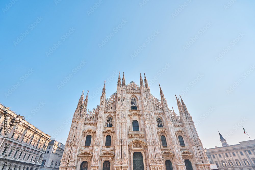 Fototapeta premium Milan Cathedral on sunny day, Italy. Milan Cathedral or Duomo di Milano is top tourist attraction of Milan.