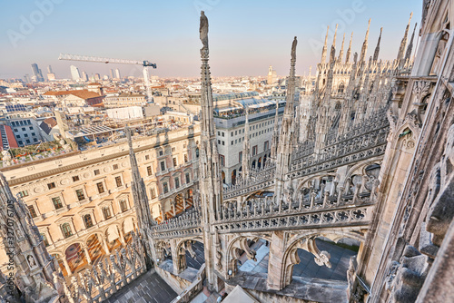 Amazing view of old Gothic spires. Milan Cathedral roof on sunny day, Italy. Milan Cathedral or Duomo di Milano is top tourist attraction of Milan. © malkovkosta