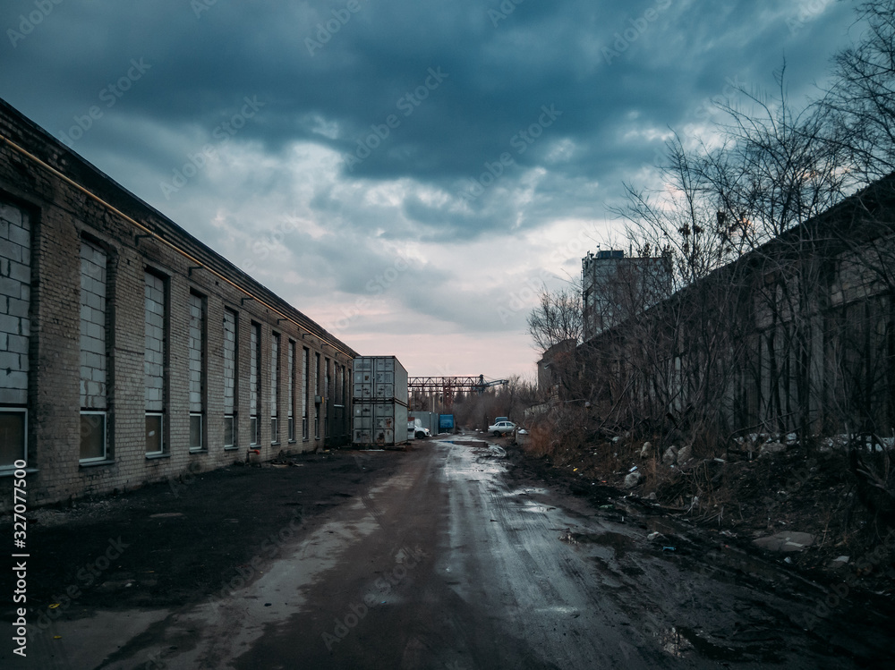 Depressive territory of abandoned industrial area, old warehouses