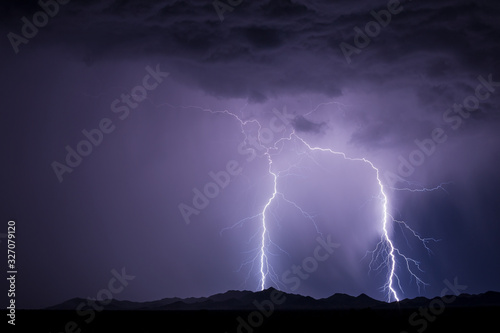 Lightning bolts strike from a thunderstorm