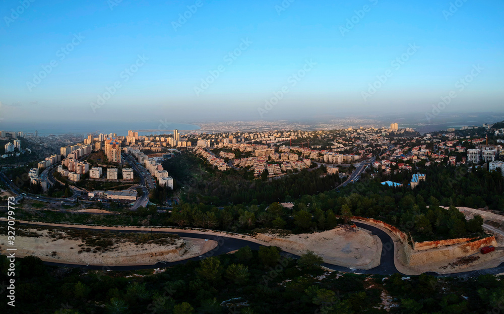 Areal shot of Haifa neighborhoods  and the Mediterranean sea in the background  