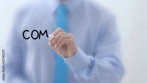 Communication written on glass. Businessman hand writing words with marker pen