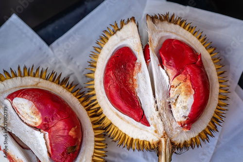 Fruits of Sabah Borneo called Durian Dalit and its flesh is in red color. The Durian Dalit for sell at the street market in Kota Kinabalu, Malaysia, close up