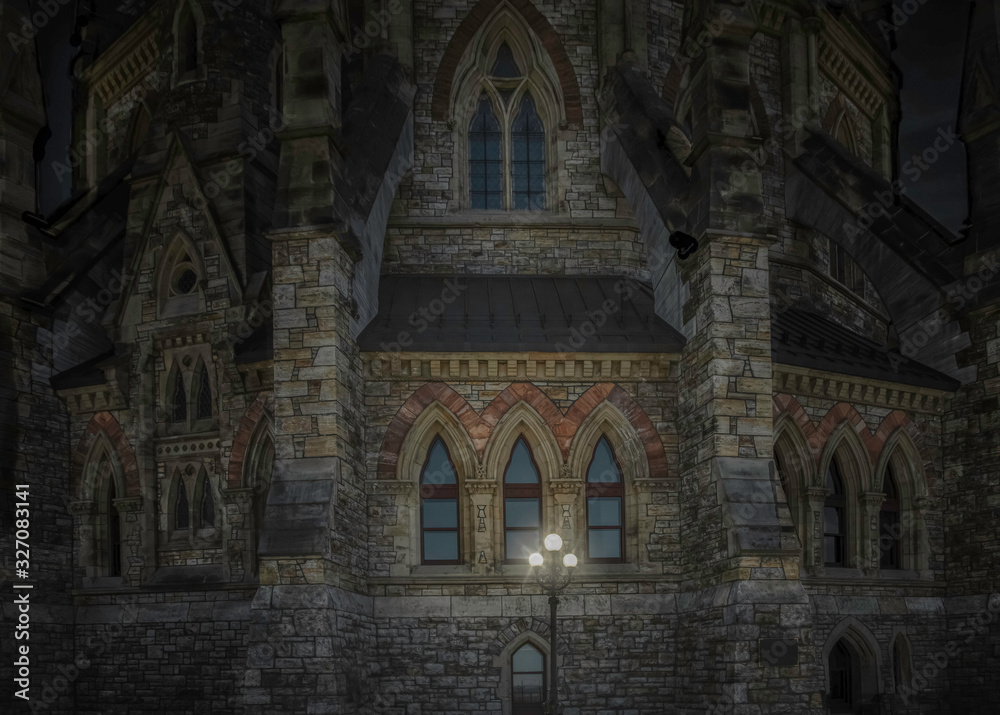 Gothic building lit at night Canada parliament library nobody