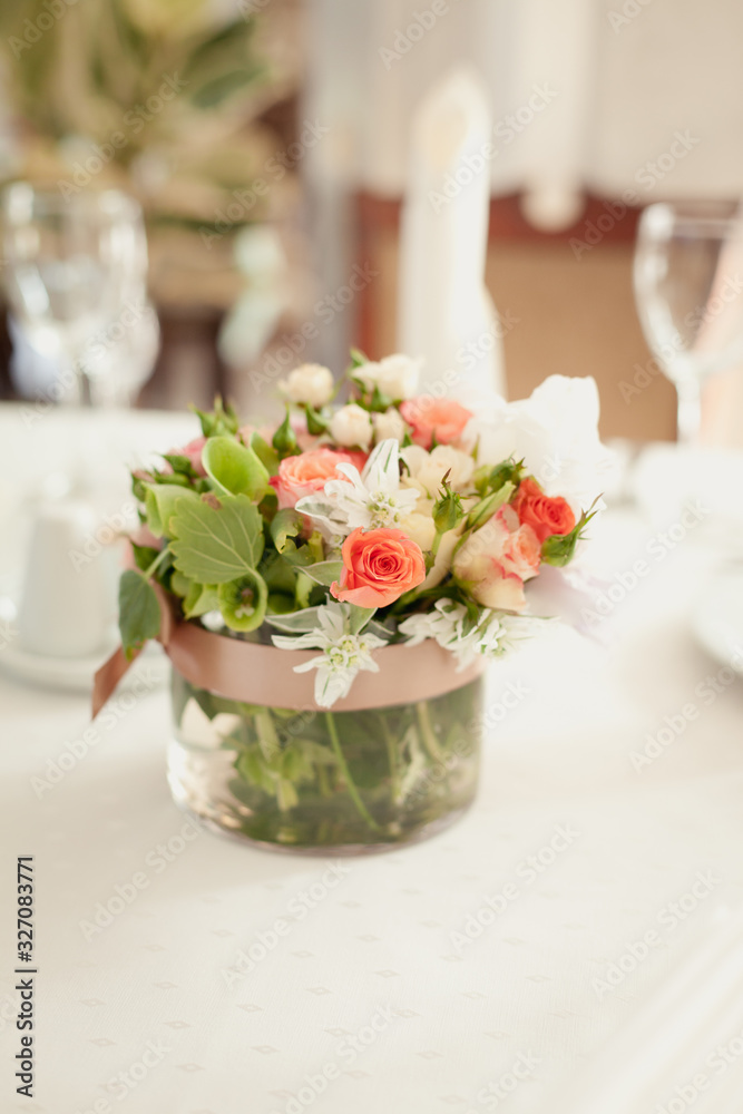 Decoration of a table. Bouquet of flowers on a table. Decoration of a table. Bouquet of flowers on a table.