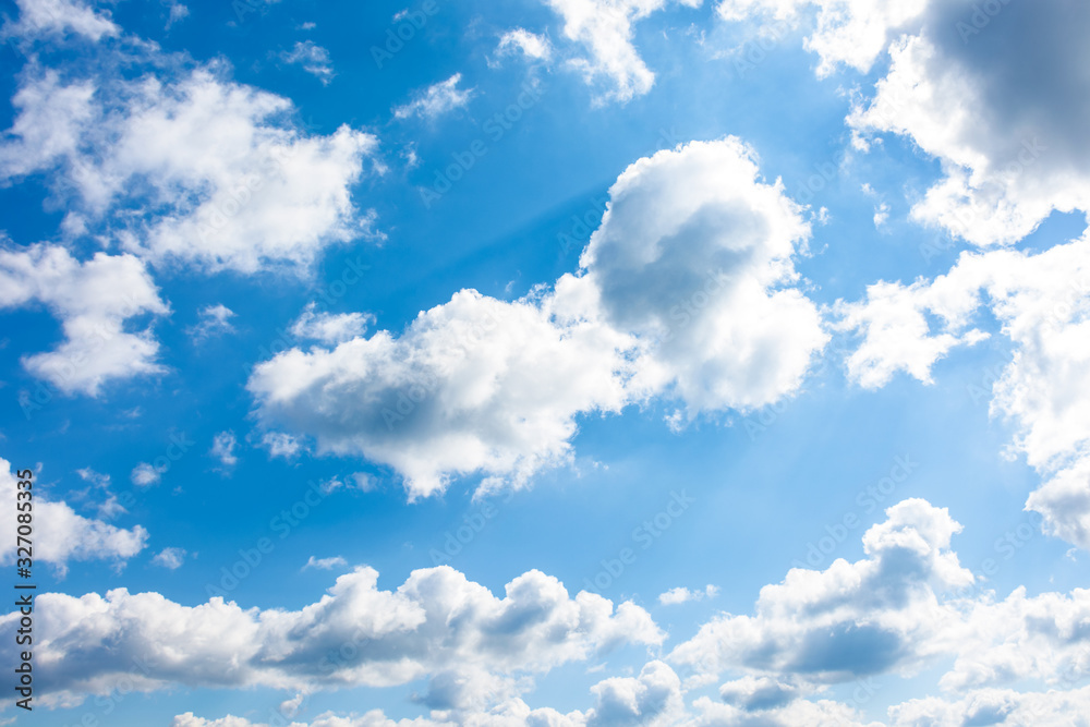 Fototapeta premium gorgeous cloudscape in springtime. weather background with dynamic cloud arrangement on a blue sky. sunny and windy day, good weather forecast concept