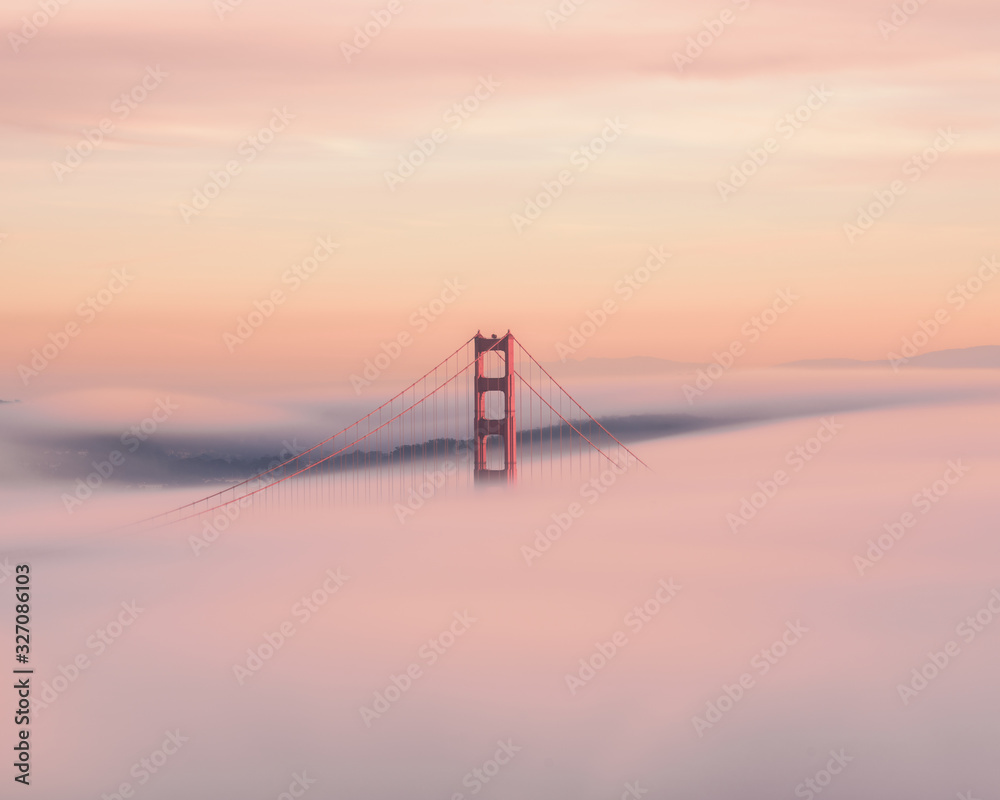 Golden Gate bridge rising from the fog.