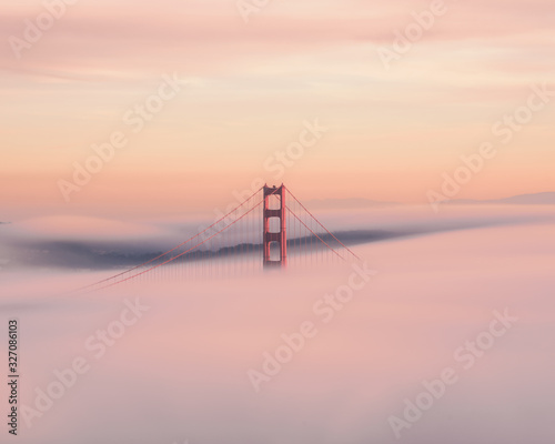 Golden Gate bridge rising from the fog.