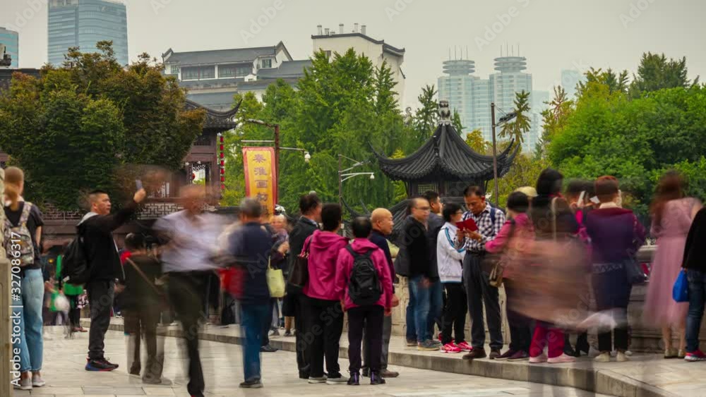 day time nanjing city famous old town crowded tourist street temple square timelapse panorama 4k china