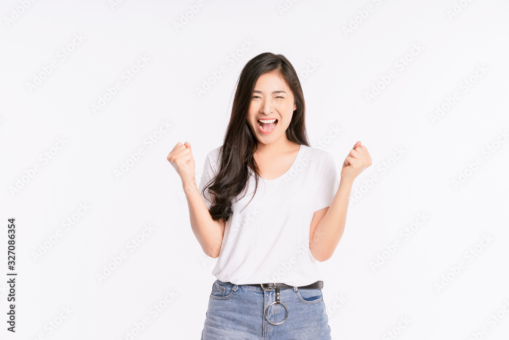 Beautiful black long hair young Asian woman, Girl feeling very happy amazed excited and surprised, studio light portrait shot isolated on white background. in a summer t-shirt Short jeans. Copy space Beautiful black long hair young Asian woman, Girl feeling very happy amazed excited and surprised, studio light portrait shot isolated on white background. in a summer t-shirt Short jeans. Copy space